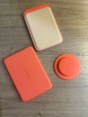 Anker Coral Orange Power Bank, Satechi Magnetic Wallet Stand, and Pop Socket